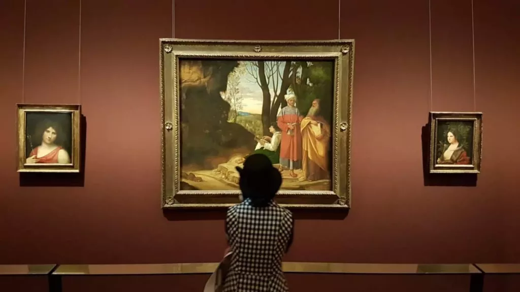 A viewer in front of Giorgione's painting. Photo: Art with me! e.U., 2019